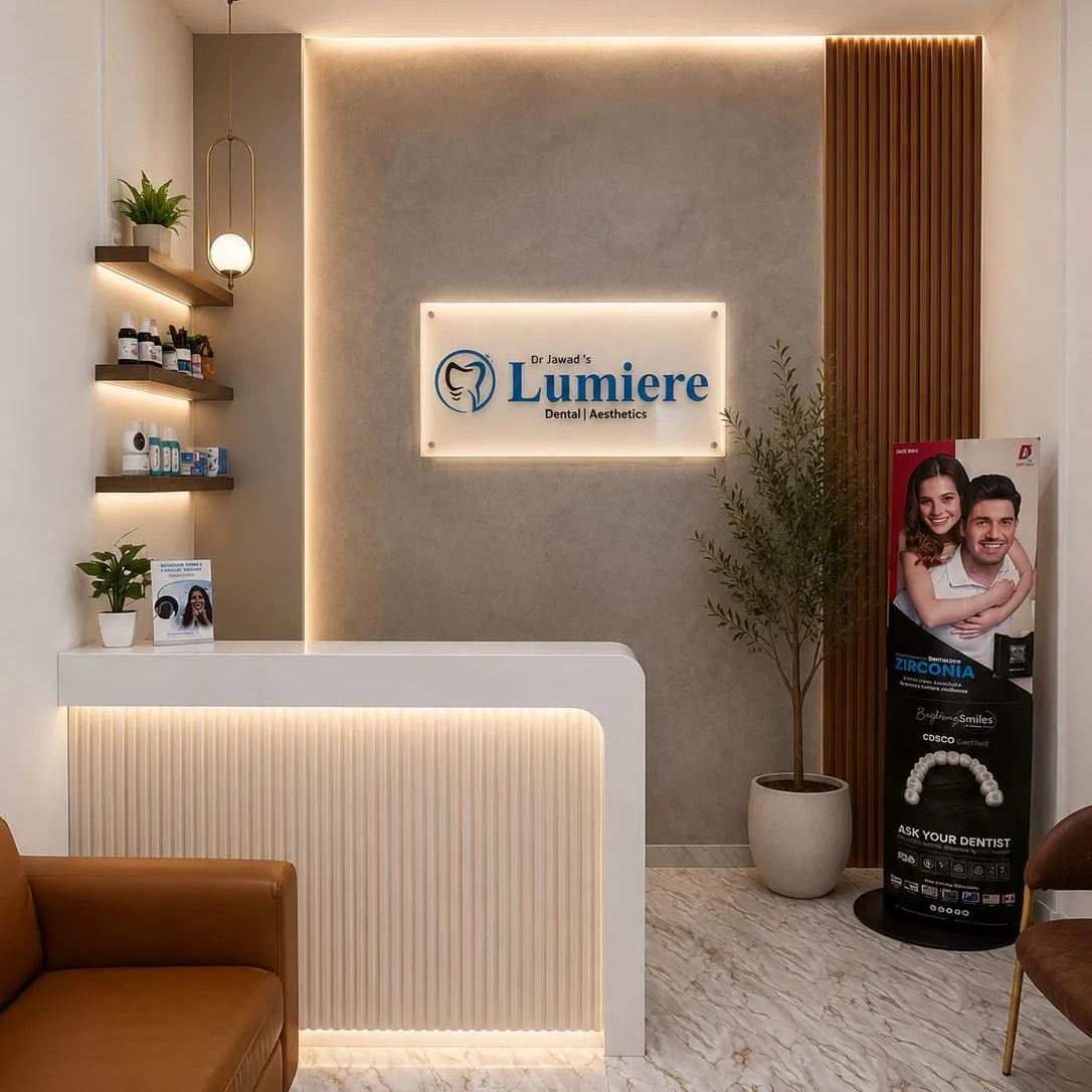 A clean and bright modern dental reception area with soft daylight streaming through large windows.