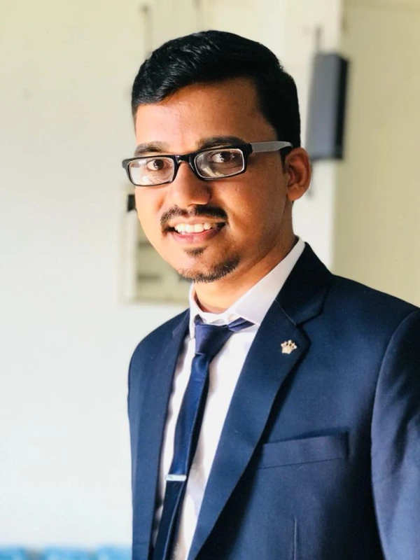 A professional portrait of Dr. Arun, Oral & Maxillofacial Surgeon.